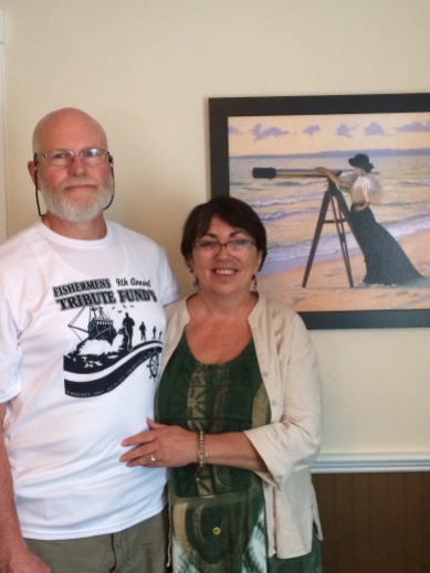 Ronnie and Deb in front of Deb's favorite picture in the house: it reminds her of herself, looking out to sea and waiting for him to come home.